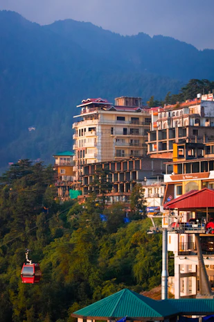 a view of a city with mountains in the background