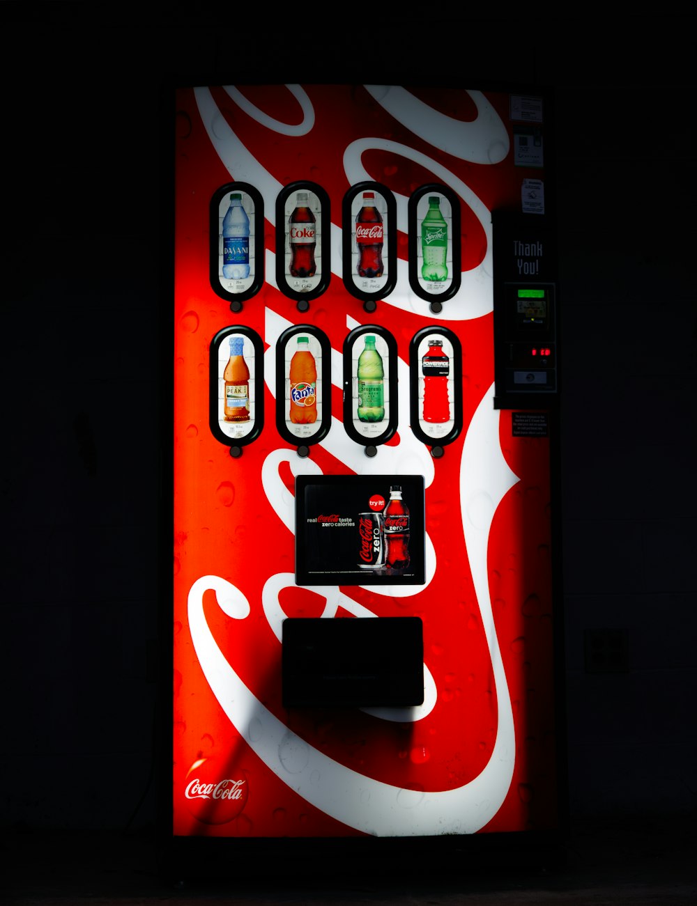 a vending machine with coca cola on it