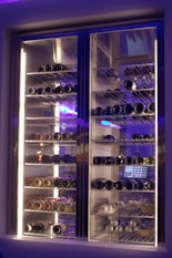 a wine cooler with many bottles of wine in it