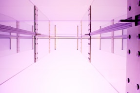a room with purple walls and a white floor