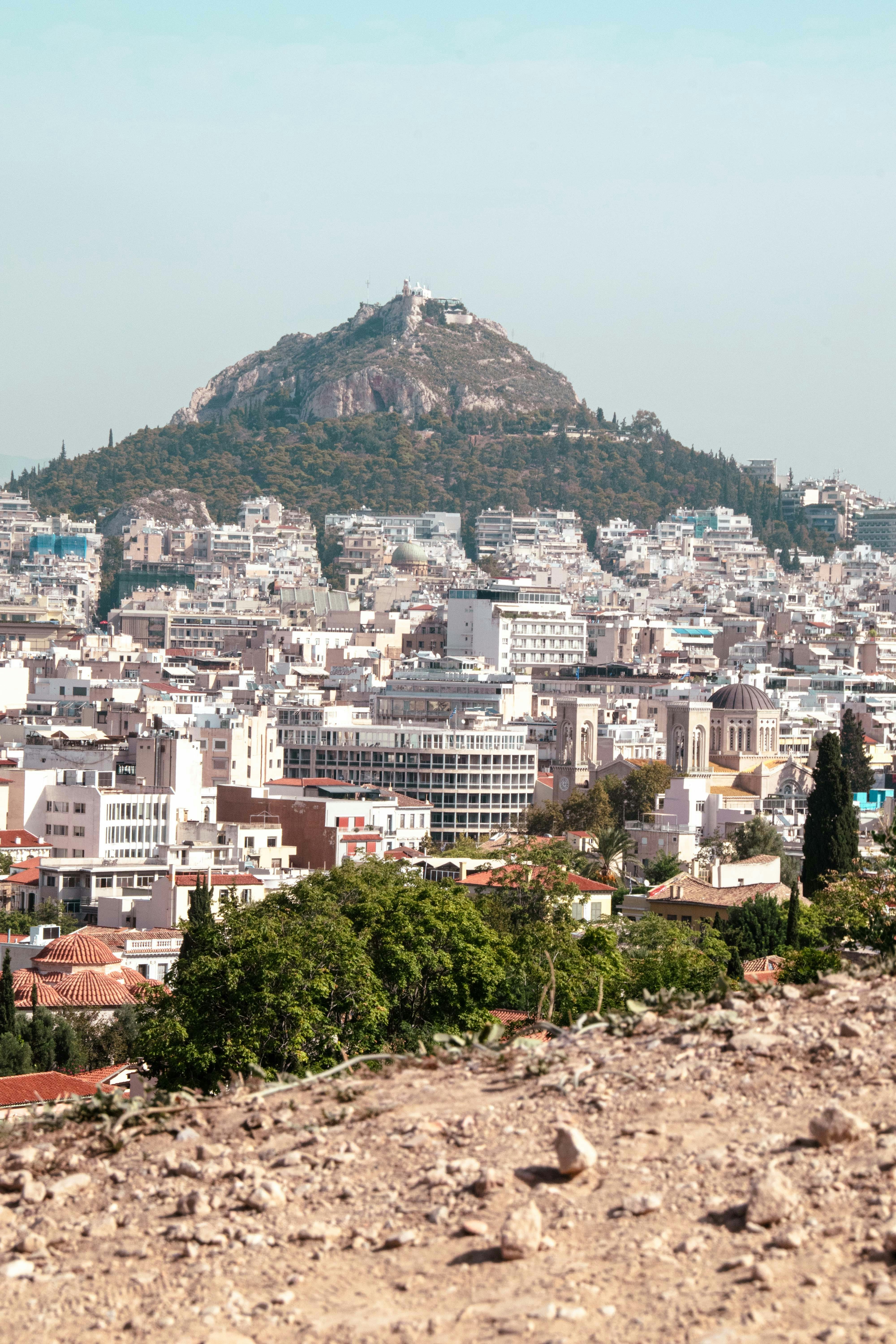 a view of a city with a mountain in the background