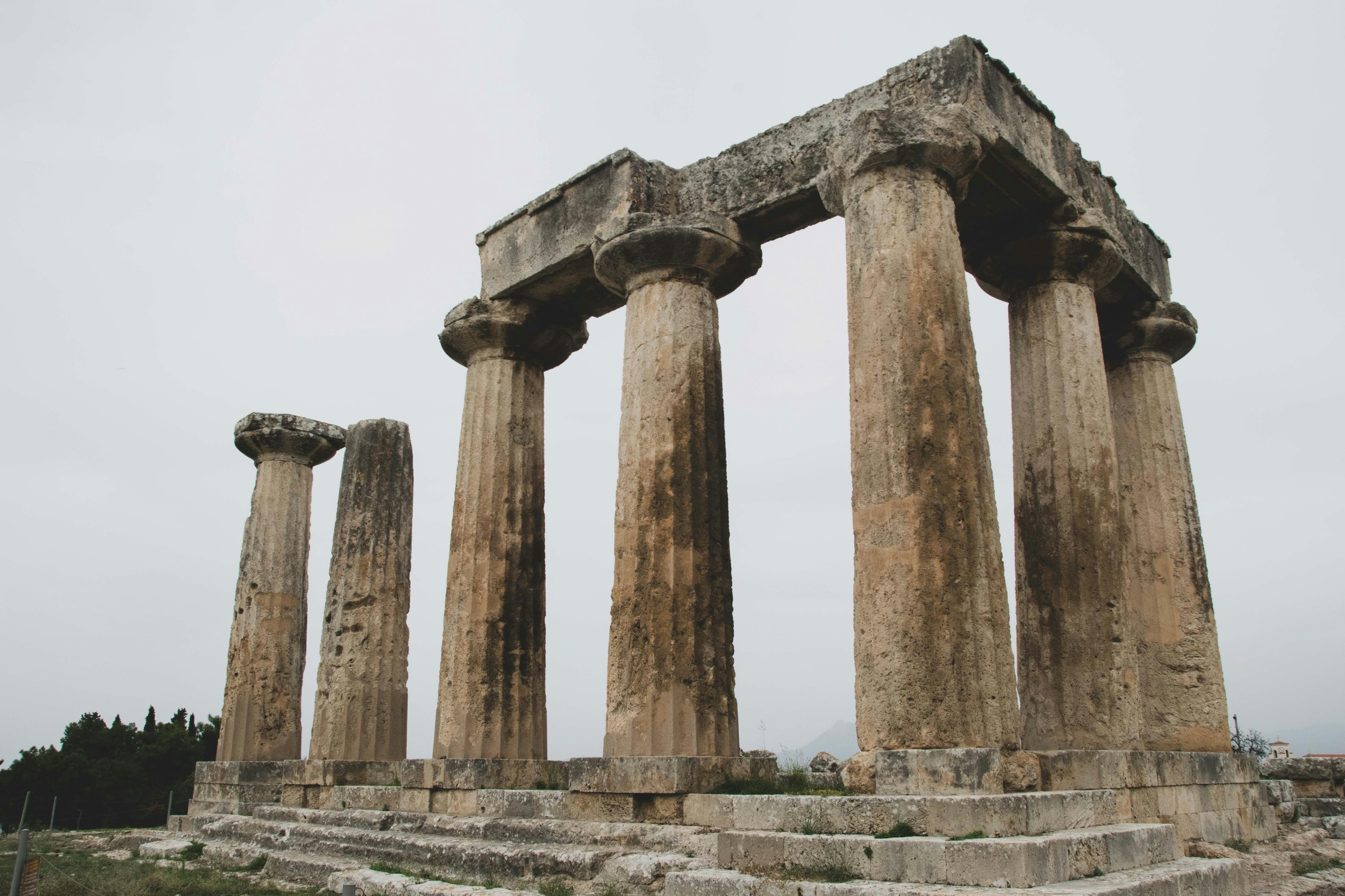 a group of stone pillars sitting next to each other