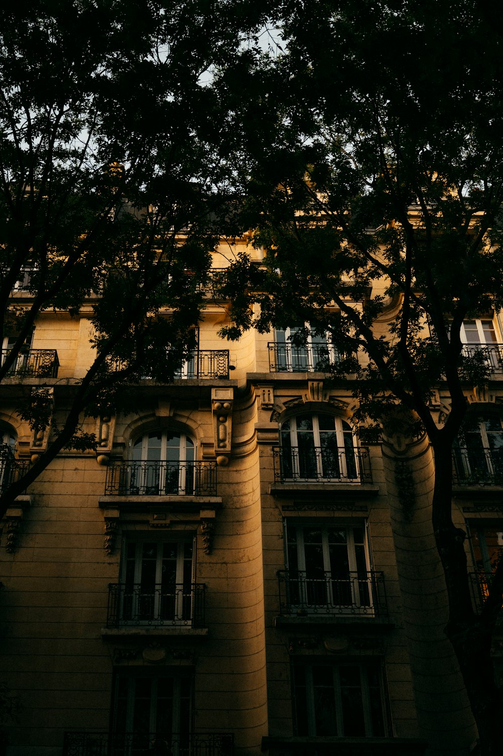 a tall building with lots of windows and balconies