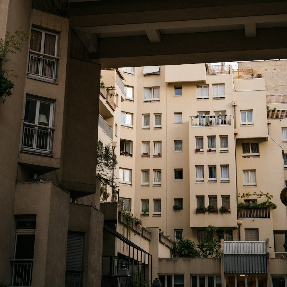 a tall building with lots of windows and balconies