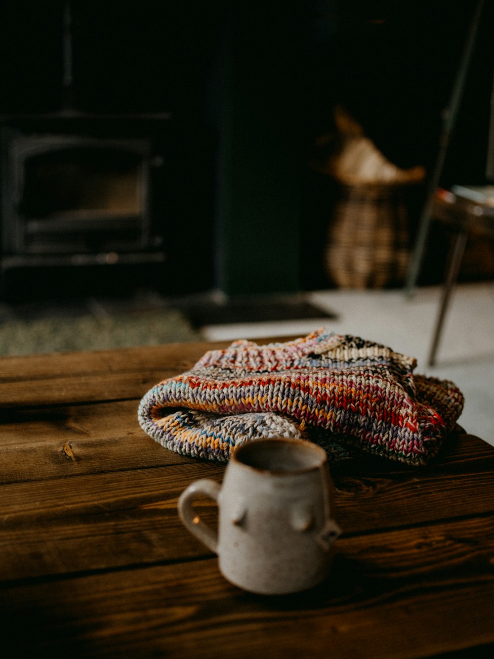 a coffee cup sitting on top of a wooden table