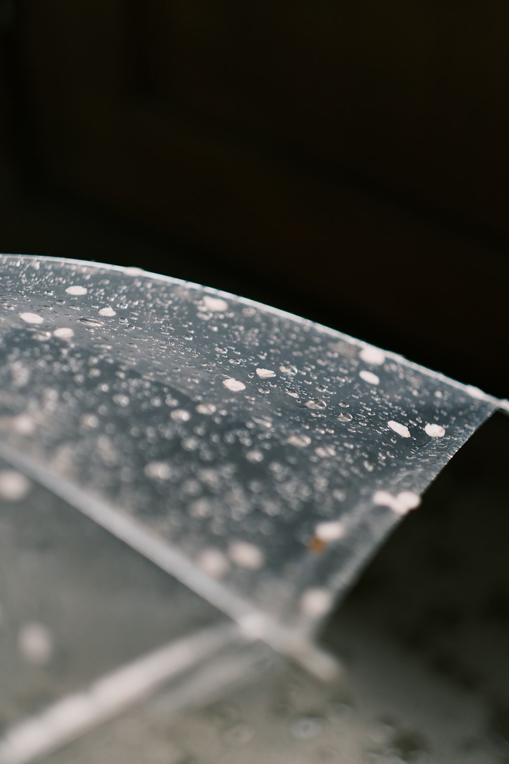 a close up of a clear umbrella on a table