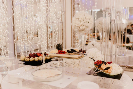 a table topped with plates of food and desserts