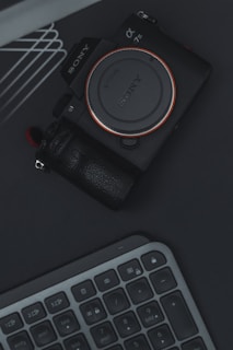 a camera sitting on top of a keyboard