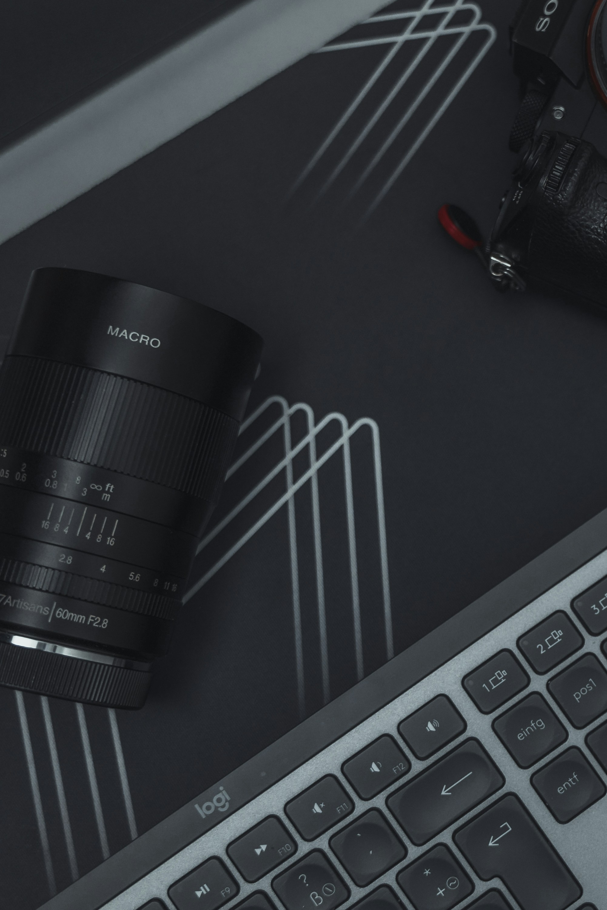 a camera sitting on top of a computer keyboard