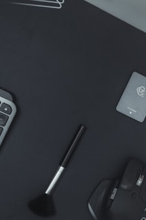 Flat lay of a minimalist workspace featuring a modern mouse pad and matching accessories.