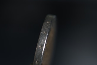 Close-up of a U.S. coin showing a clear die crack along the rim.