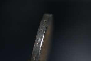 A detailed shot of a coin’s edge revealing its unique authentication markings
