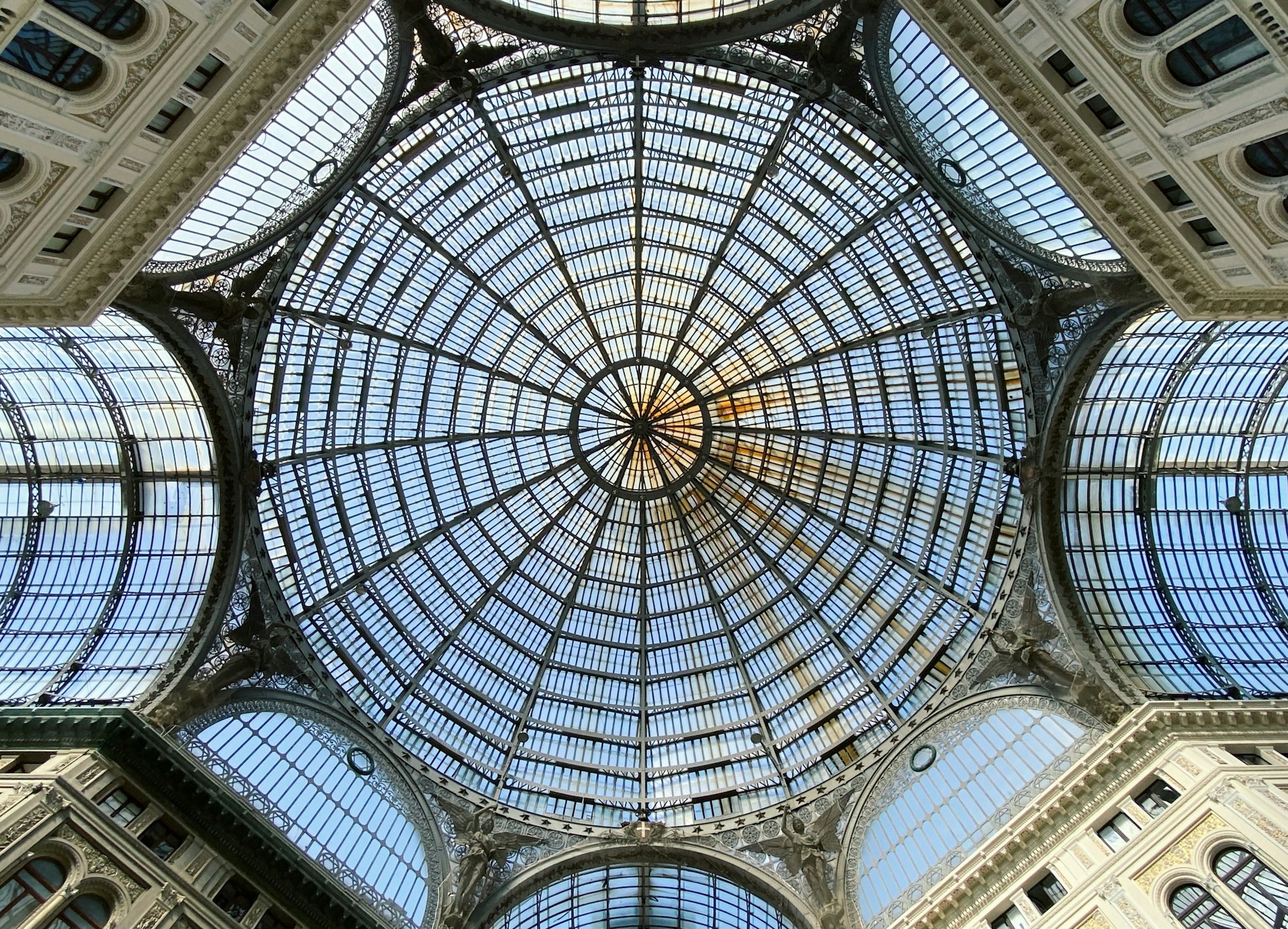 the ceiling of a building with many windows