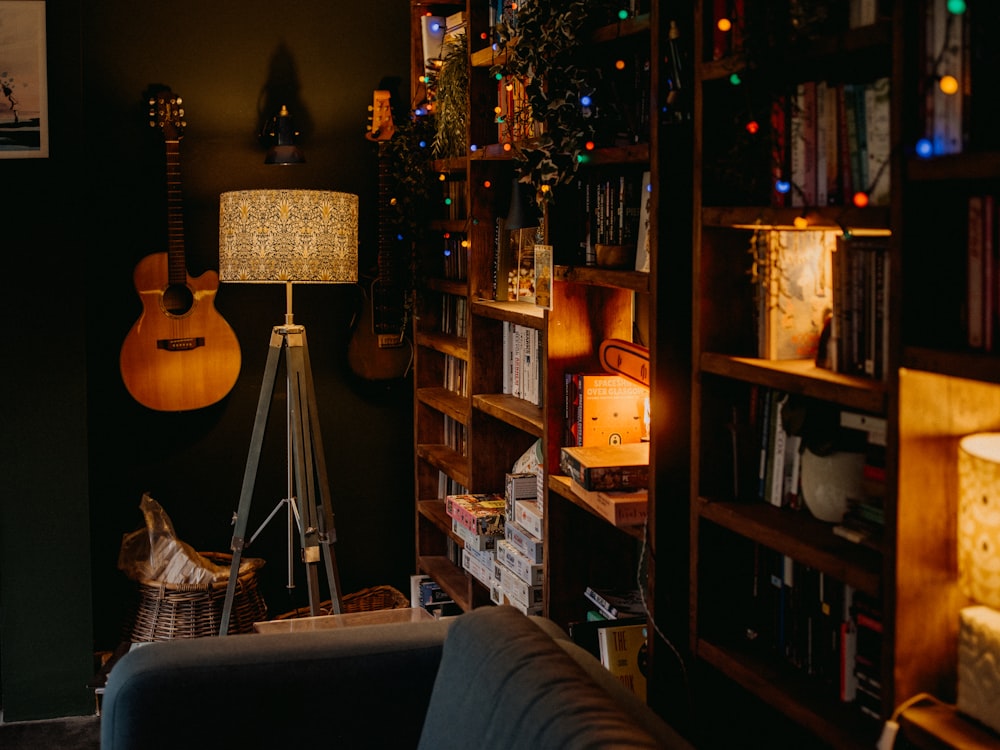 a living room filled with furniture and a guitar