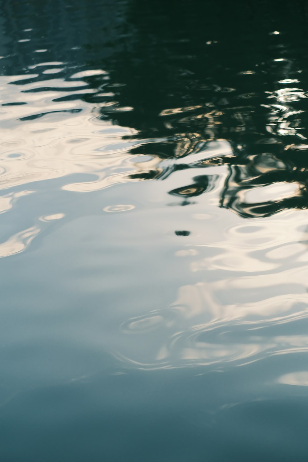 the reflection of a boat in the water