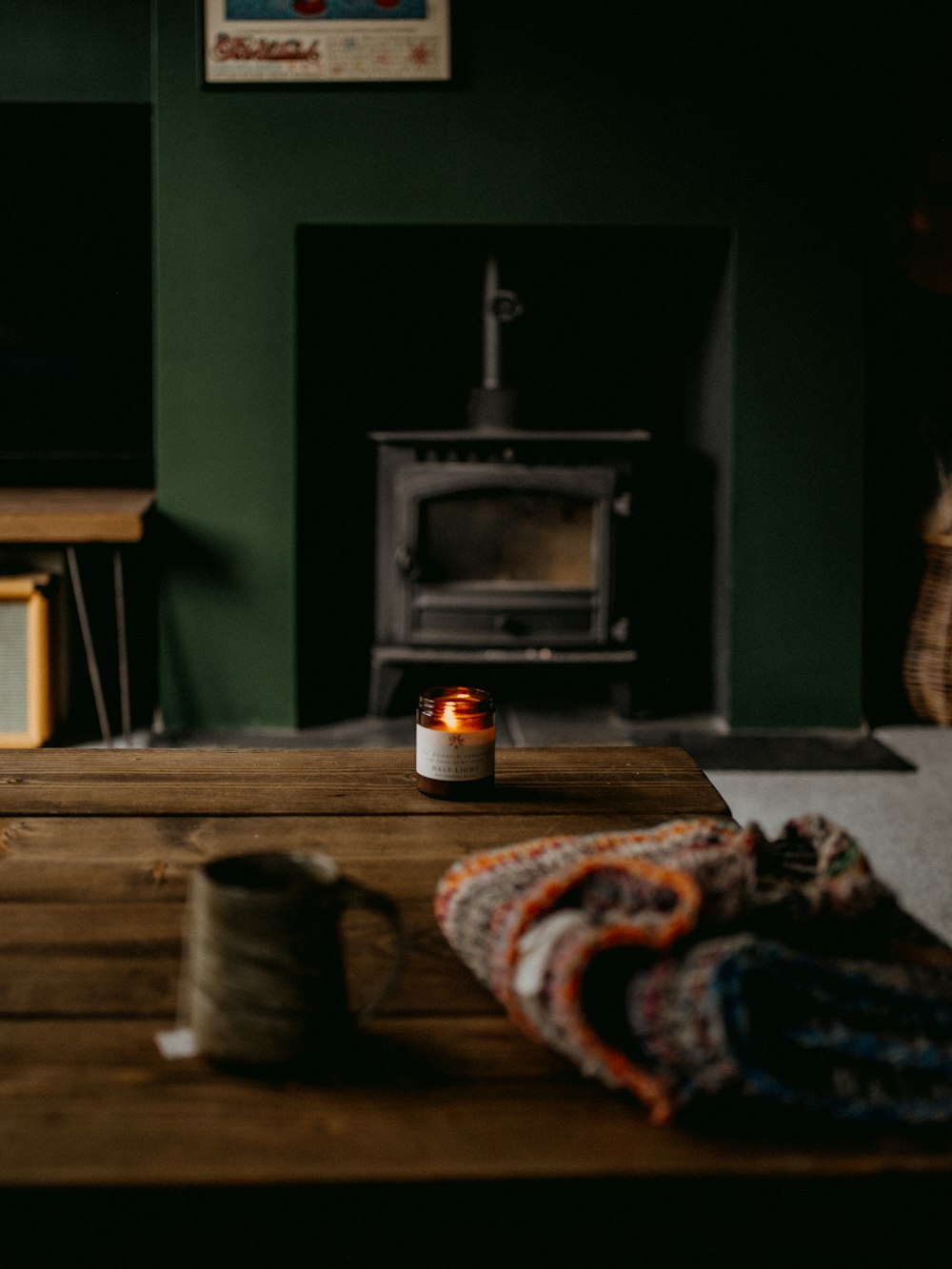 a candle sitting on top of a wooden table