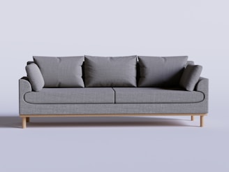 A sleek, modern compressed sofa displayed in a minimalist European-style living room.