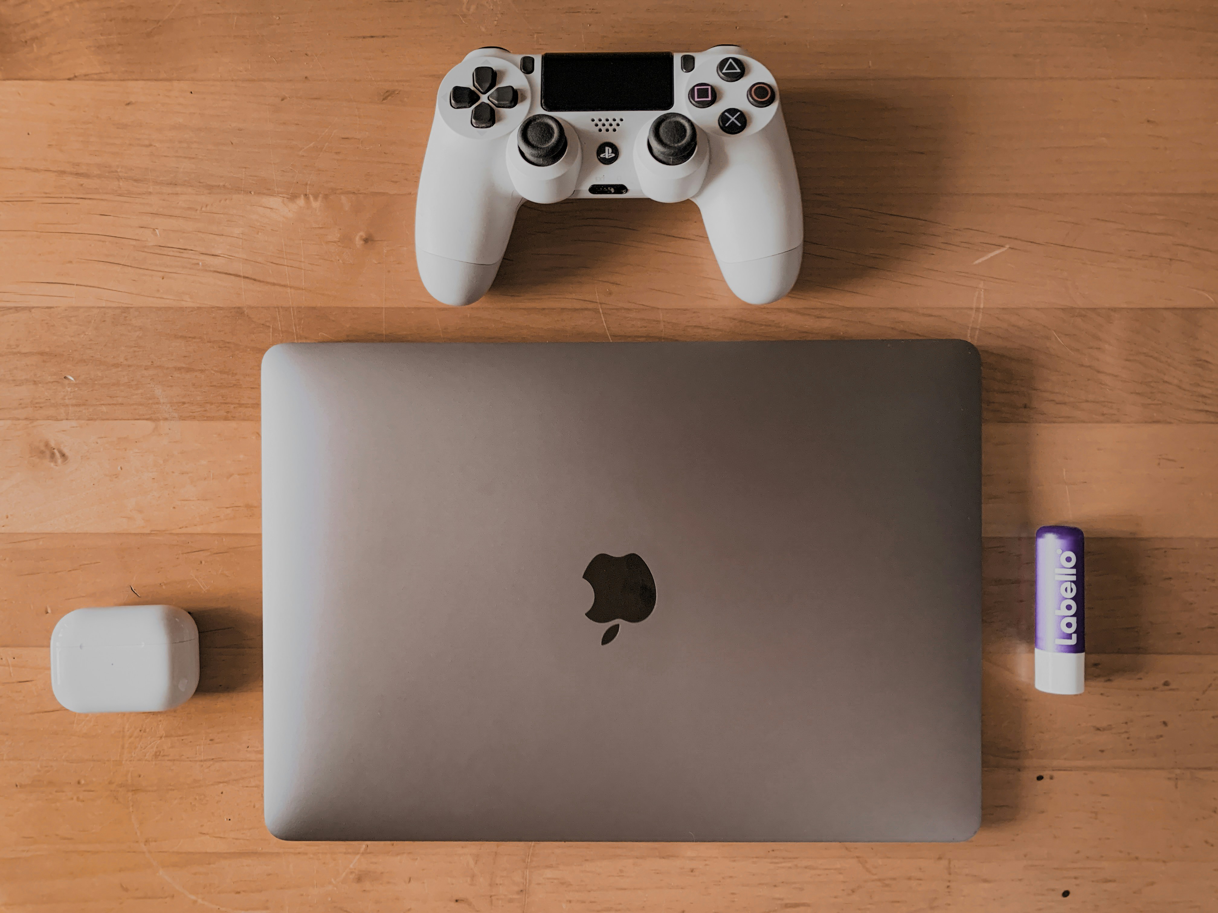 a laptop computer sitting on top of a wooden table
