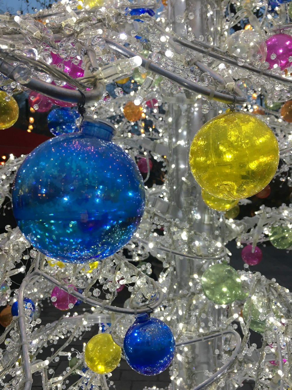 a close up of a christmas tree with ornaments