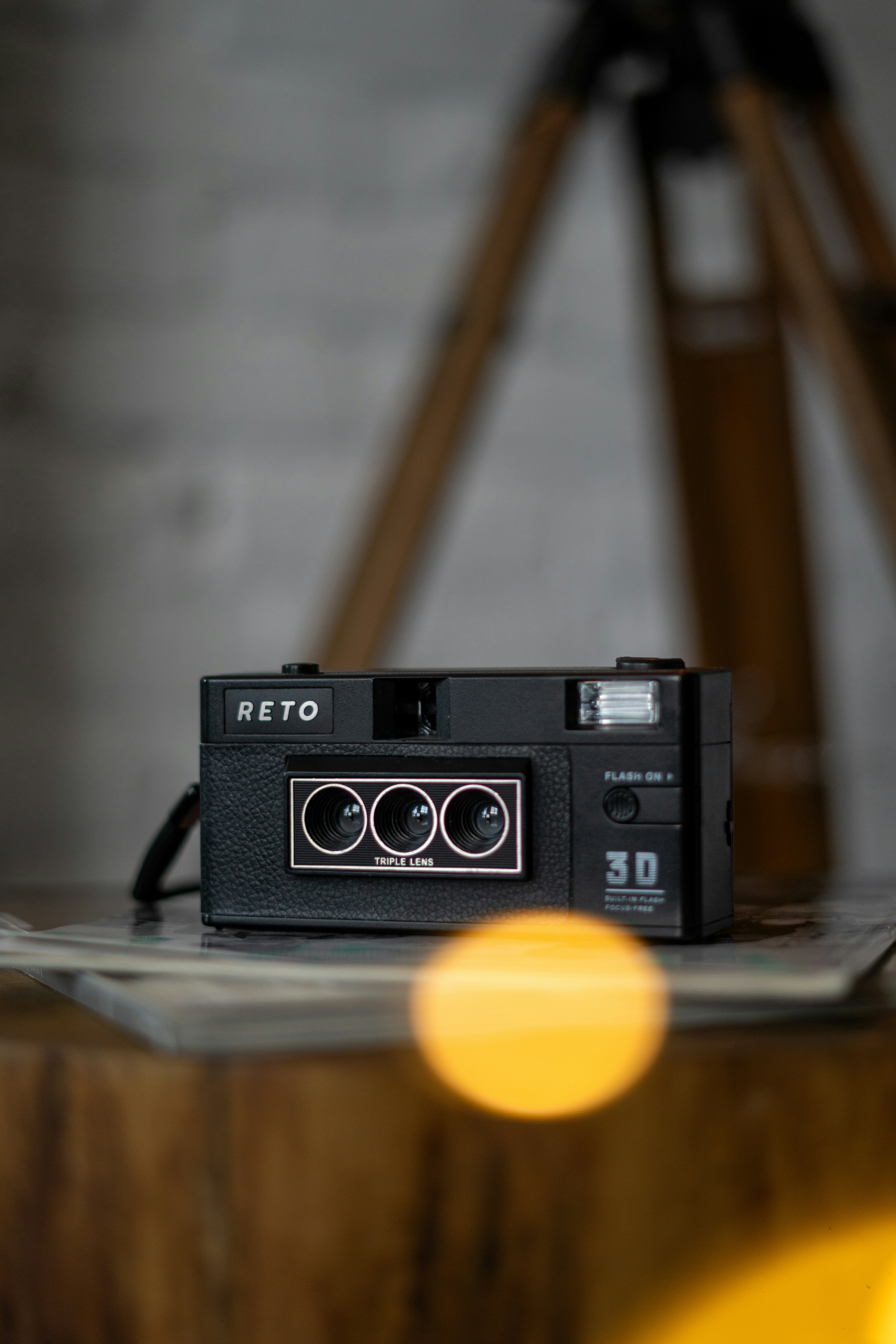 a camera sitting on top of a wooden table