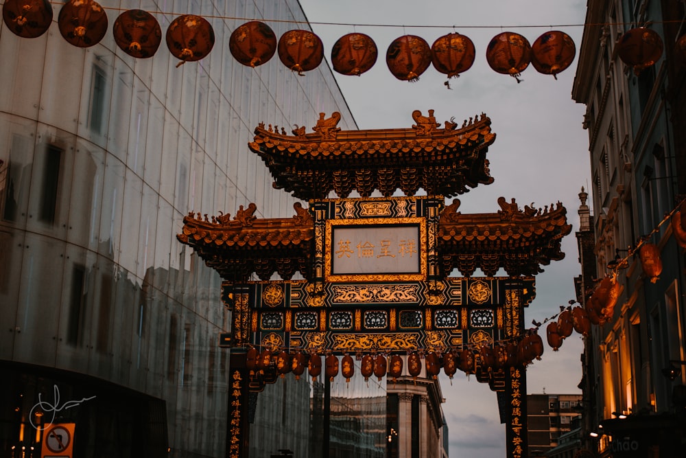 a clock hanging from the side of a building