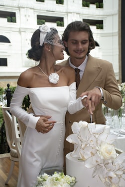 A couple happily planning their wedding with a budget tool.