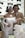 A happy couple enjoying a beautifully decorated wedding cake.