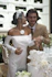 A joyful bride and groom celebrating their wedding surrounded by elegant floral decorations.