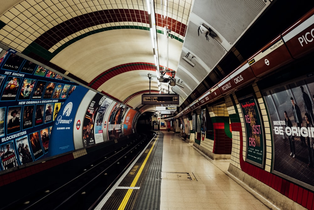 a subway station with a train pulling into it