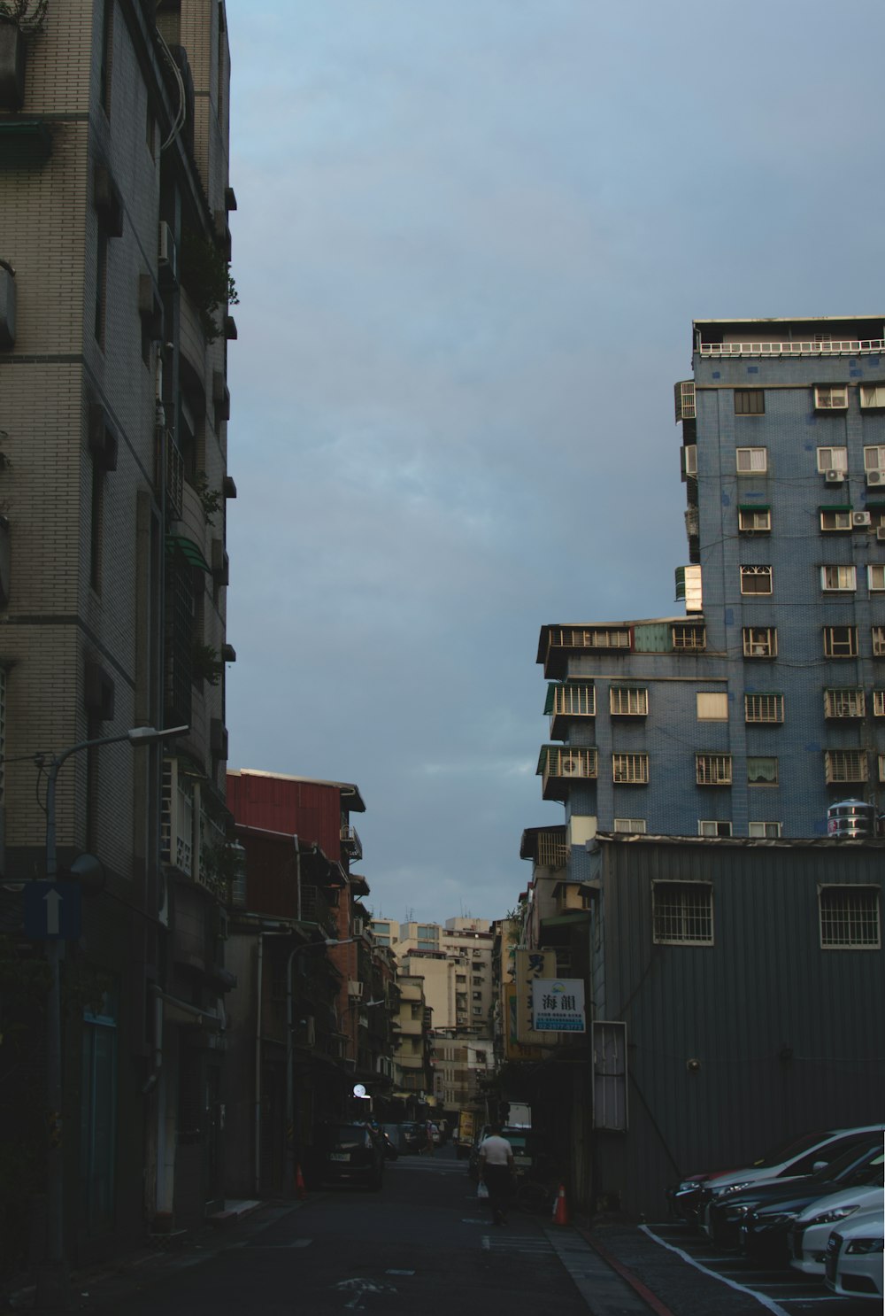 a city street with tall buildings on both sides