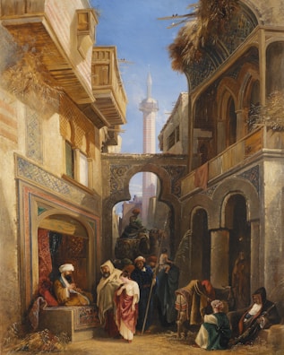 A bustling Middle Eastern street scene features a variety of people in traditional attire. An intricate architectural setting with arches and balconies frames the view. The scene is lively, with people engaging with each other and moving through the space. A notable tower rises in the background under a clear blue sky.
