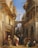 A bustling Middle Eastern street scene features a variety of people in traditional attire. An intricate architectural setting with arches and balconies frames the view. The scene is lively, with people engaging with each other and moving through the space. A notable tower rises in the background under a clear blue sky.
