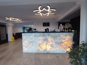 A modern office lobby featuring an Elegant Glow Sign glowing warmly above the reception desk.