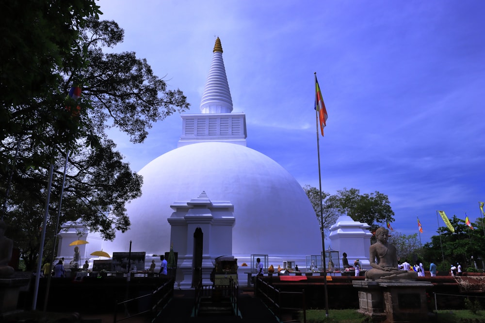 a large white building with a tall spire