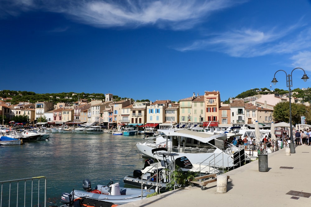 a harbor filled with lots of boats next to buildings