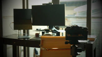 A creative workspace filled with storyboards, cameras, and sound equipment.