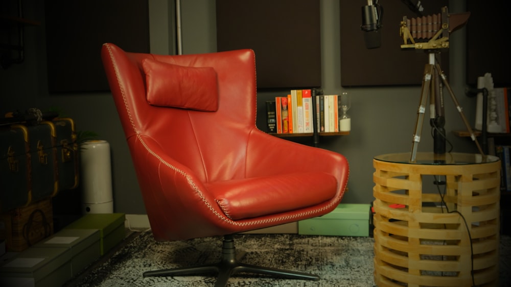 a red leather chair sitting in a living room