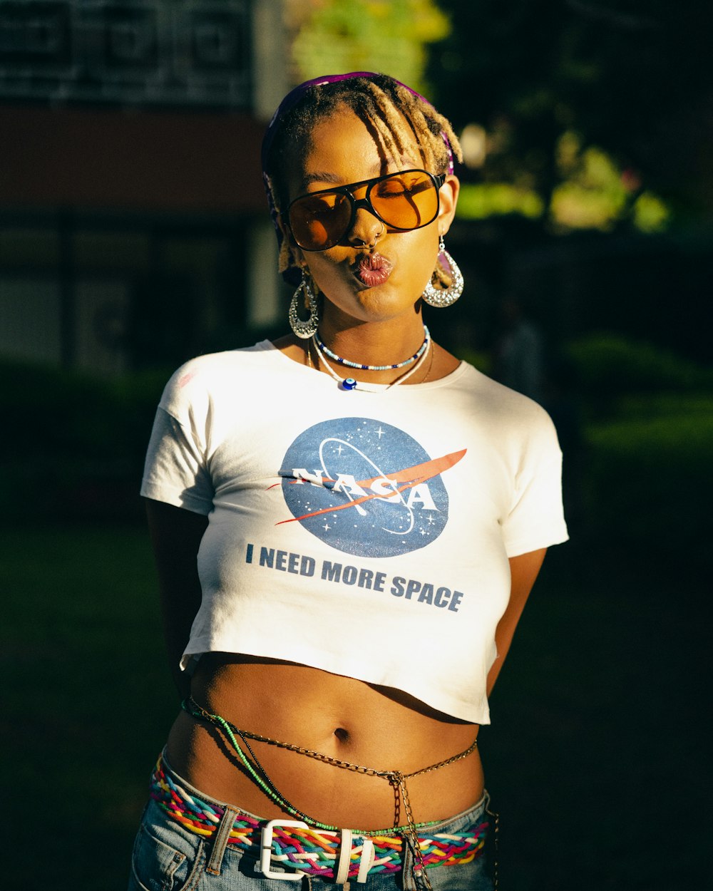 a woman wearing a t - shirt that says i need more space