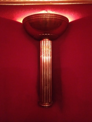 Elegant wall-mounted sconces illuminating a peaceful reading nook