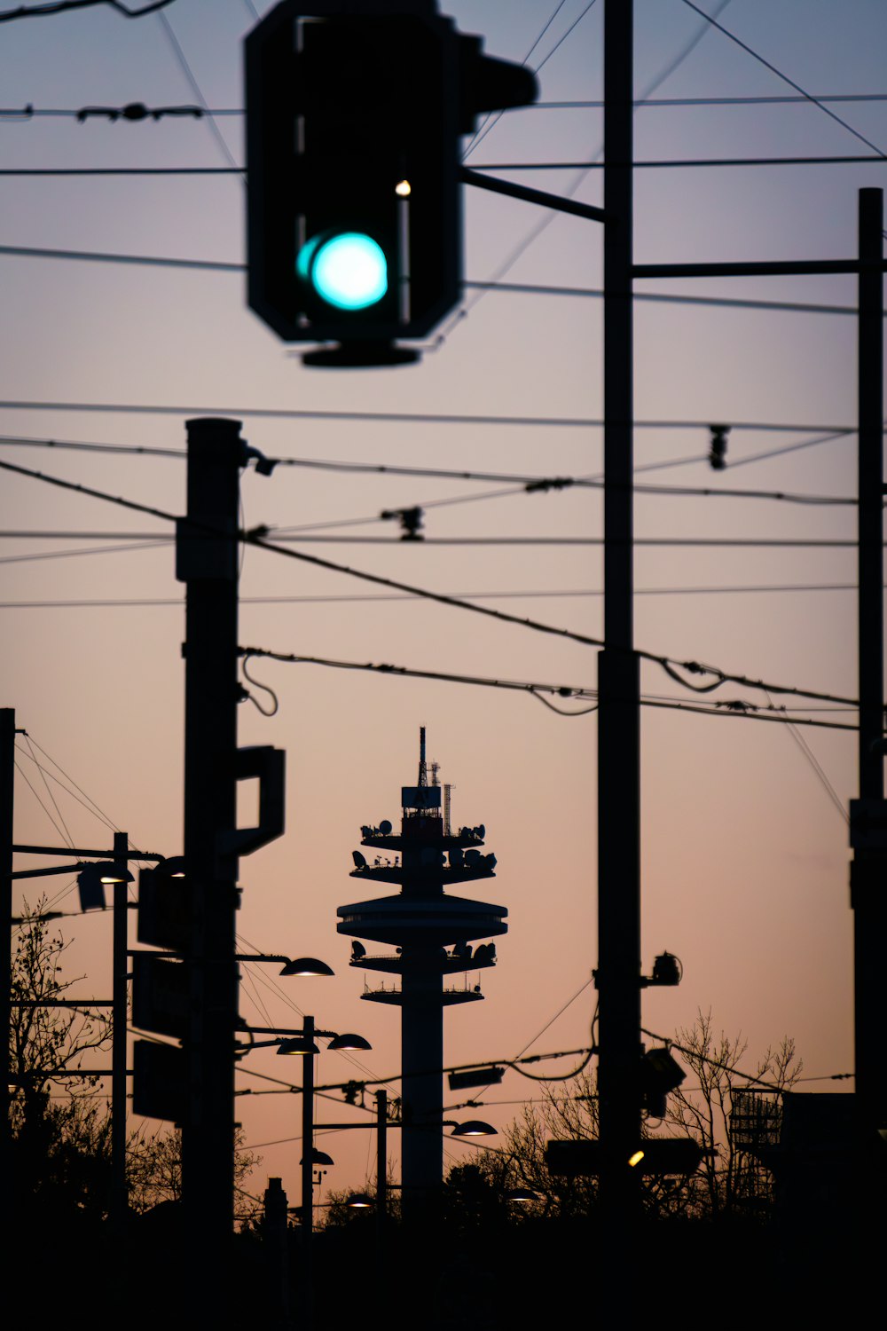 a traffic light hanging from the side of a pole