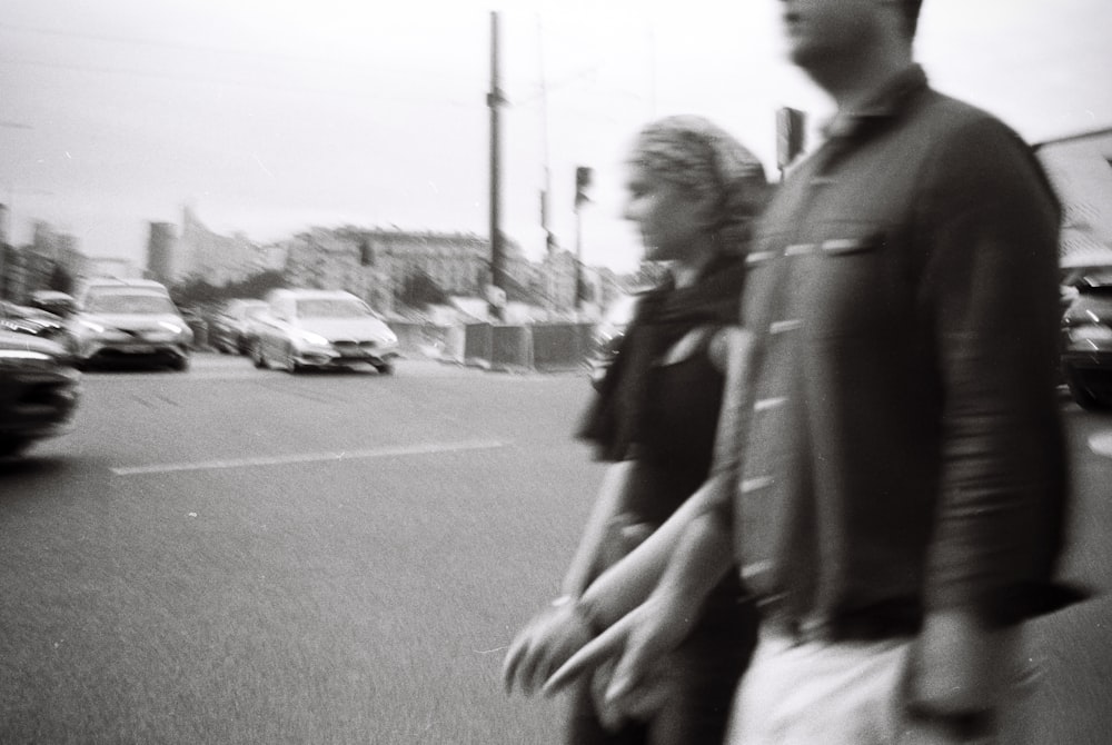 a man and a woman walking down a street