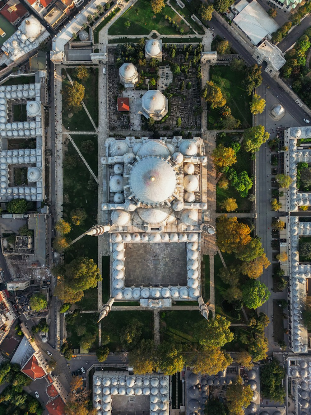 a bird's eye view of a large building in the middle of a park
