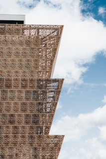 a tall building with a sky in the background