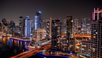 a view of a city at night from the top of a building