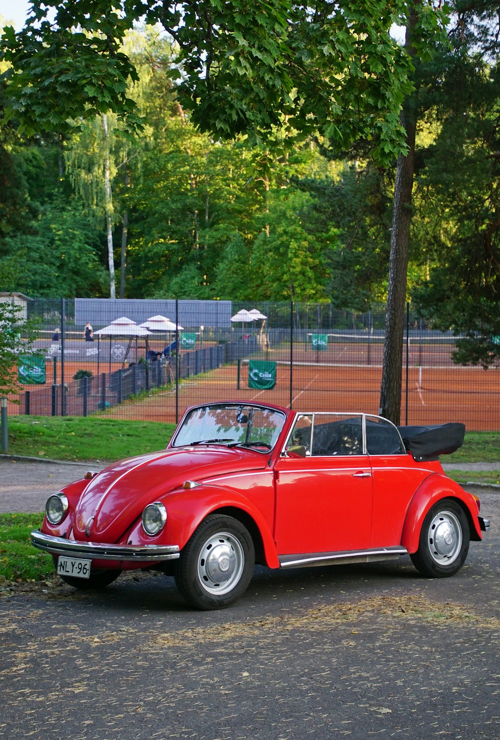 a red car parked on the side of the road