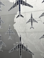 Various aviation plotters and navigation tools displayed against a map backdrop.