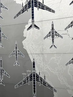 Wide shot of a blueprint featuring a sleek modern airplane design with technical annotations