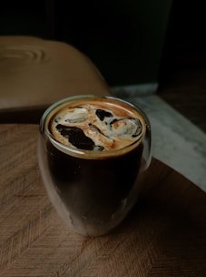 a close up of a cup of coffee on a table