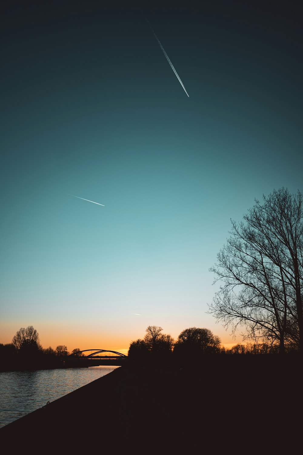 an airplane is flying over a body of water