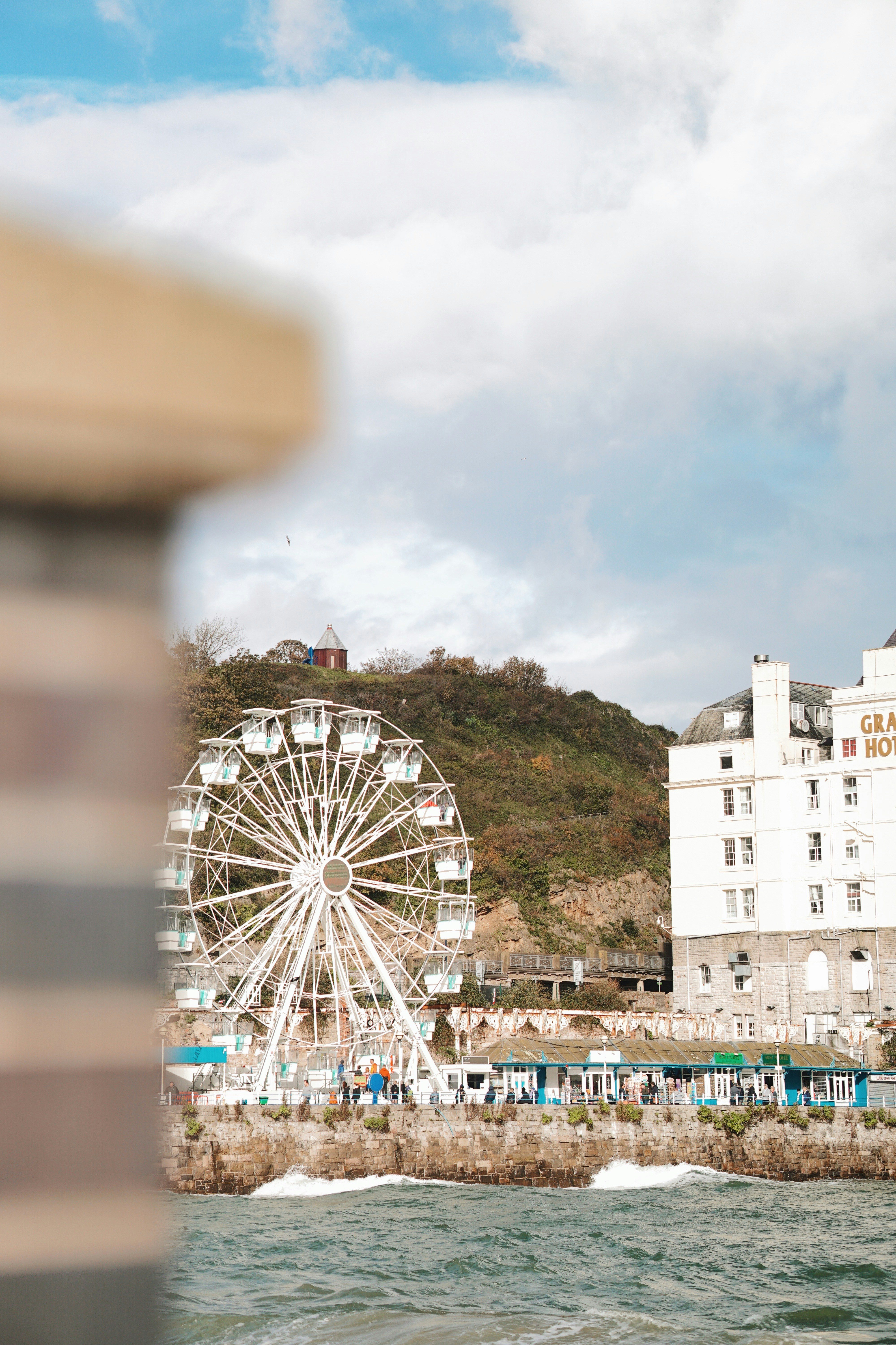 a large ferris wheel sitting next to a building